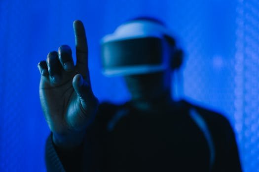 Close-up of a person in a VR headset interacting, showcasing a modern technology setup.