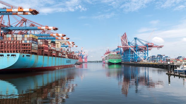 View of large container ships at Hamburg harbor, highlighting global trade and maritime logistics.