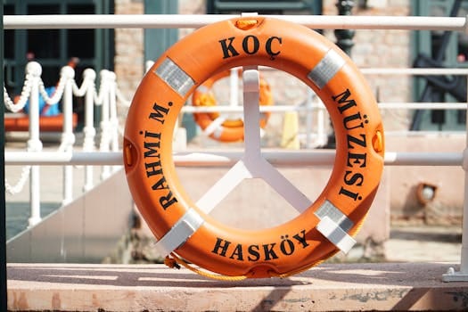 Bright orange lifebuoy with Rahmi M. Koç Müzes logos at Hasköy, Istanbul.