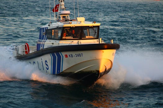 Dynamic capture of a Turkish police boat slicing through ocean waves at high speed, flag in view.