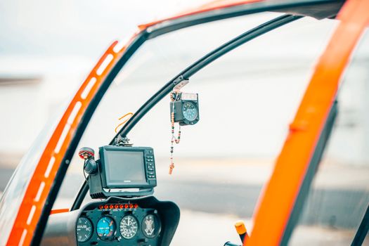 Detailed view of helicopter cockpit instruments inside an aircraft.