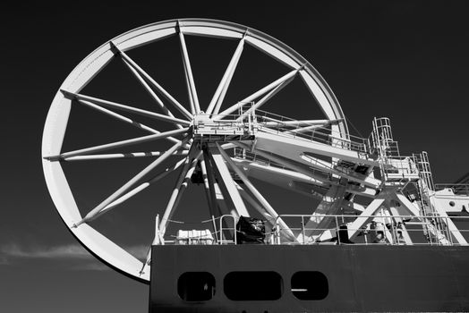 Black and white image of a large industrial ship wheel mechanism in Bremerhaven, Germany.